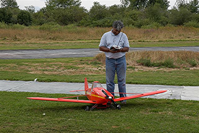 Krish with Pawnee, her name is Bug Juice, due to working Hopper visible below Fuselage!